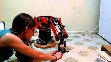 Scorbot-ER III mixing up a Rubik