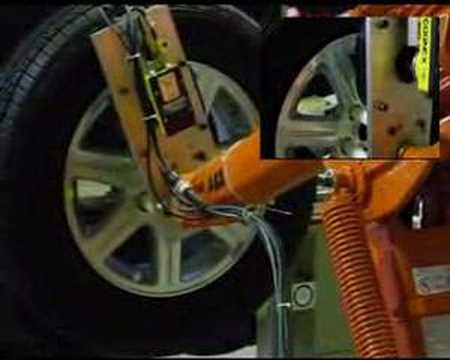 Robot tracks a moving tire to fasten bolts