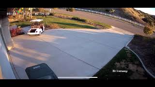 Kid rides golf cart in driveway and crashes into flower pot