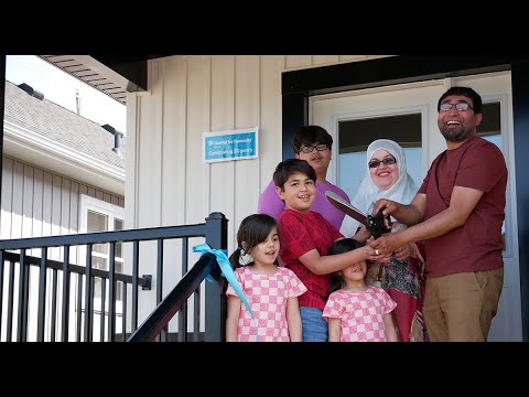 Three families receive the keys to Habitat homes