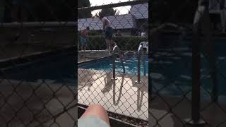 Kid tries to backflip from divingboard and misses the pool completely