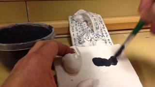 applying underglaze to incised letters