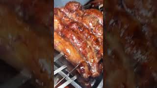 This is a piece of meat being grilled on a hot grill.