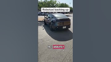Robotaxi backing up in a busy parking lot autonomously. This is the future
