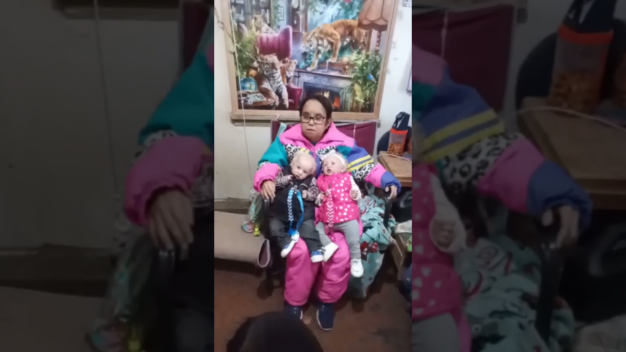 Kelly holding her niece and nephew Michael and Michelle