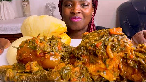 African food assorted +cow skin +smoked chicken +vegetable soup with Fufu /eating show no talking