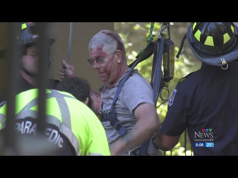 Window washer stuck hanging from the side of B.C. building