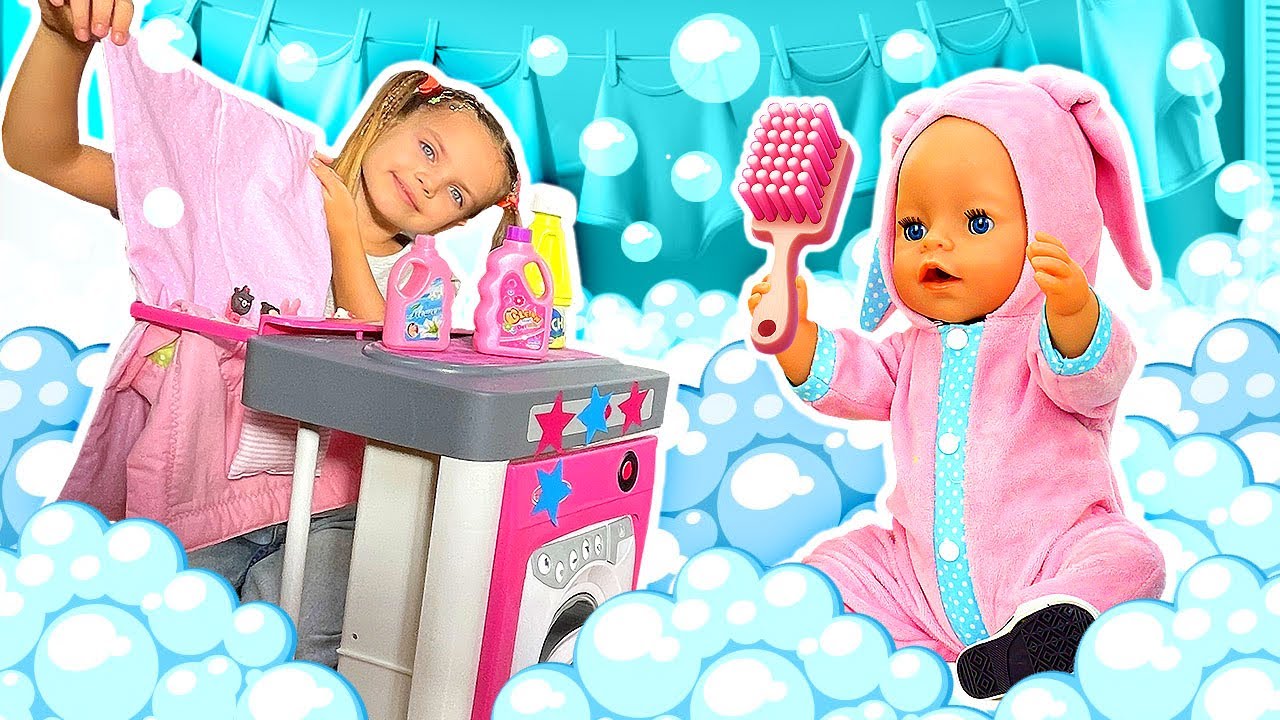 Maya does housework, feeds and bathes the baby doll and cleans the house with mom and toys.