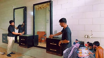 Installing shop decorations with Amir