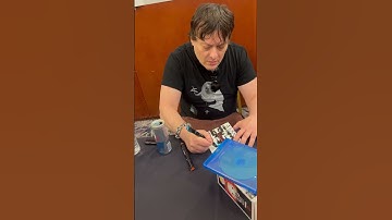Edward Furlong signing Terminator 6 movie Blu-ray sleeve.