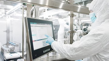 Automated filling of syringes under aseptic conditions