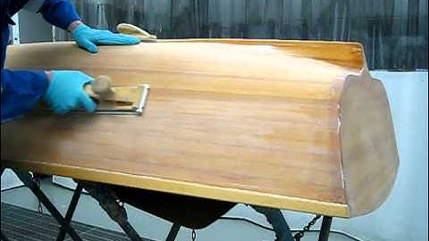 Sanding wooden small boat