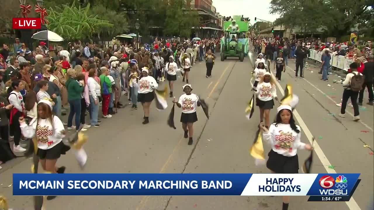 McMain Secondary Marching Band performs in the holiday parade