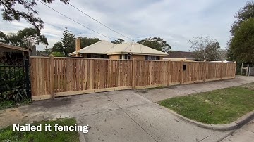Cypress picket front fence with pyramid top exposed posts and sliding gate