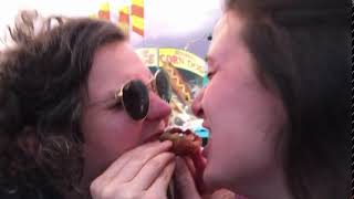 Helen And Rebecca Trying A Deep Fried Twix In A Lady-And-The-Tramp-Esque Fashion.