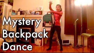 Girl dances with mystery backpack (Jump From Paper)