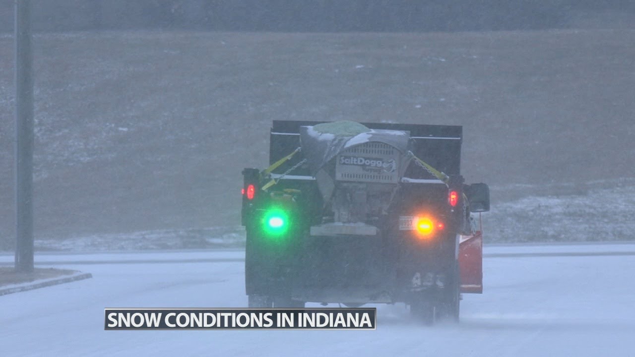 Officials in southern Indiana ask residents to stay off the roads as crews treat streets, roads