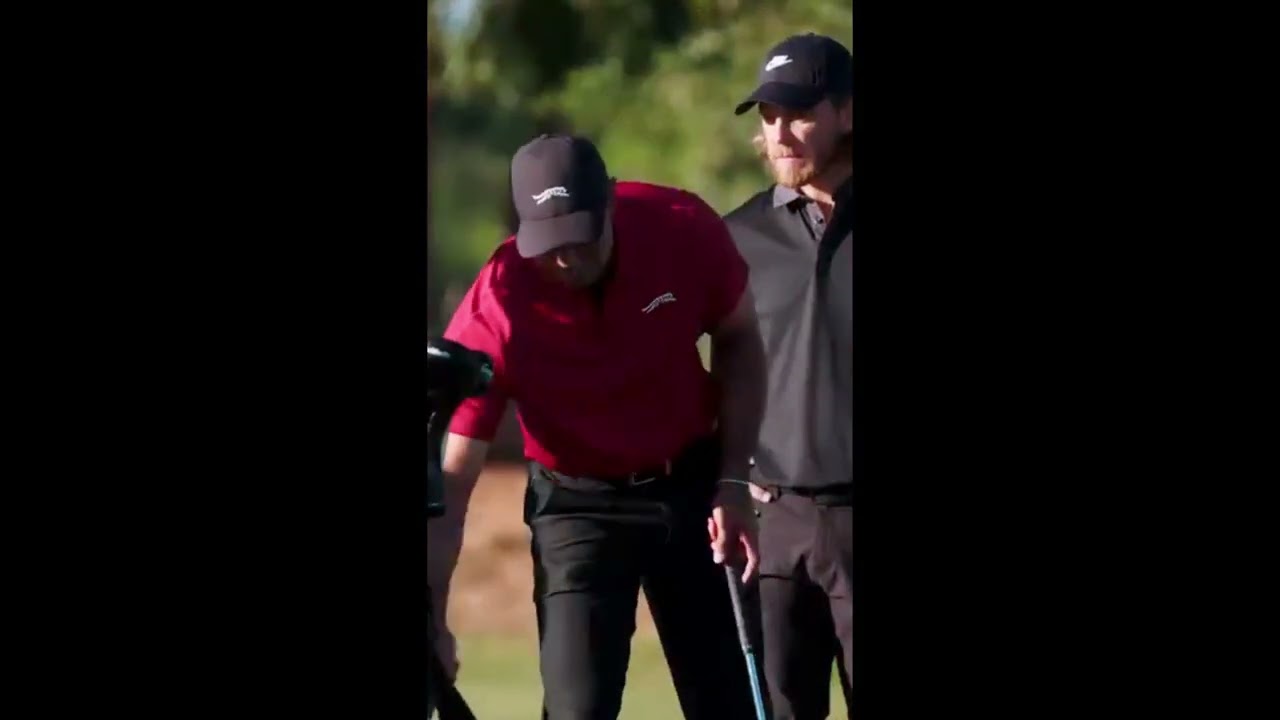 Tiger Woods with the most nonchalant 3-yard flop shot you'll ever see.