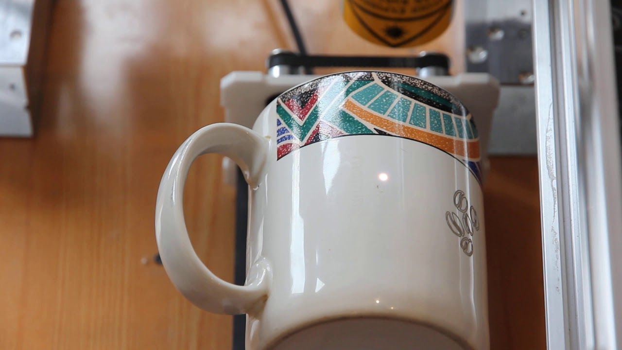 Engraving on a coffee cup (ceramics engraving) using a 10 watt DPSS