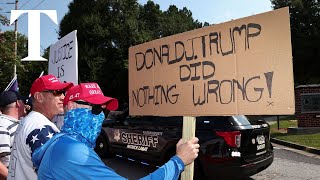 Trump supporters gather outside Georgia jail where he is set to surrender