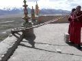 Young monks playing tibetan horns at thikse gompa monastery