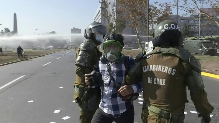 Chilean police disperse May Day protest with water cannons, arrests | AFP