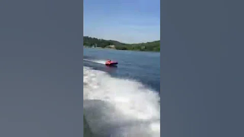 Old man on a tube behind a 24' boat!