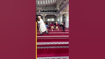 Turkish imam plays with kids in Masjid