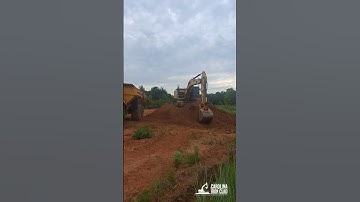 Moving Top Soil in Denver, NC with Caterpillar 324EL Excavator and Volvo A45G Dump Truck