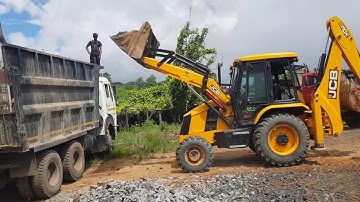 jcb loading gravel in a dump truck
