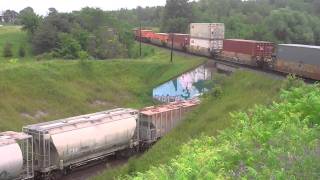 CP intermodal/autorack train meets CN freight at Beare.