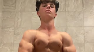 Handsome muscular teen boy showing off his muscle