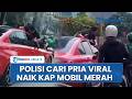 Bikin Heboh! Polisi Selidiki Aksi Pria Bergelantungan di Mobil Merah Viral di Jakarta Barat