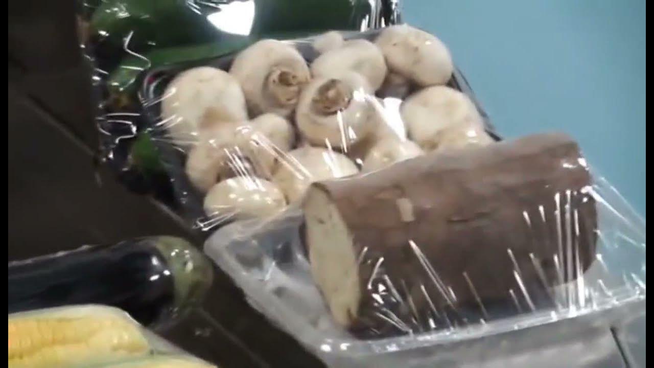 Automatic food tray wrapping machine with stretch cling wrap film fruit