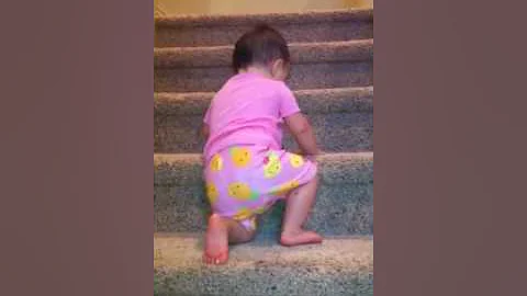 Aly crawling up the stairs