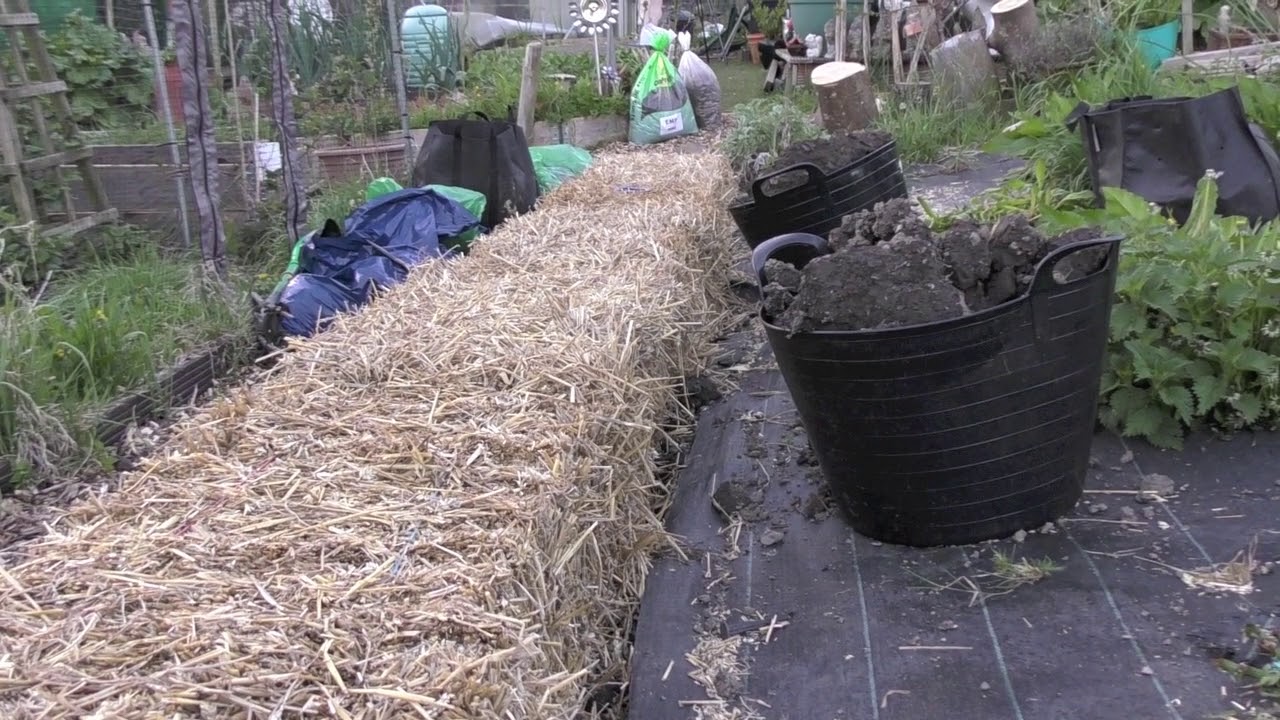 Constructing A Retaining Wall Using Straw Bales Youtube