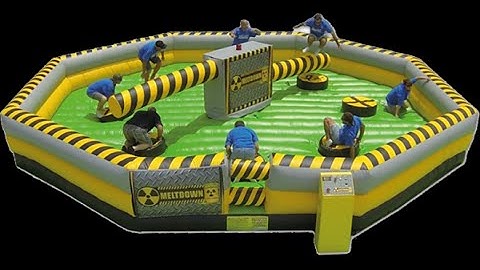 Funny Funny Video of Guy gets knocked out on Meltdown Wipeout game