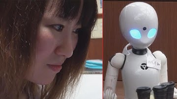 Woman in Wheelchair Uses Robot Waiter to Serve Food to Customers
