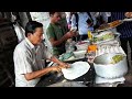 Expert guy making moglai porota at Kolkata street food stall