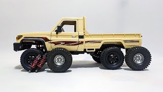 Mn82 Enhancing the Land Cruiser 79: Upgraded Oil Shocks & Tire Transformation for Maximum Interest!