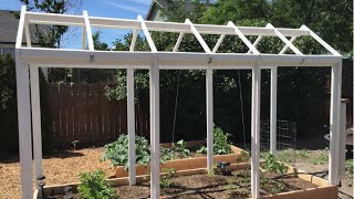 There are many overhead structures one could build; some cost more than others. I chose this elegant design for my raised bed 