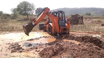 JCB Backhoe Machine Blocking Water in Small River The Working For Bridge Construction / JCB Road