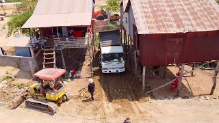 Professional work !! bulldozer komat'su​ D20P & Truck 5T​ Pushing the soil Under the cramped house.
