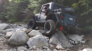 Jeep TJ 2.5L with 5.13 gears and highline flares on 35's wheeling some local obstacles.