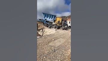 BTMA truck-mounted mobile box crusher with vibrating feeder and conveyor and vibrating screen.
