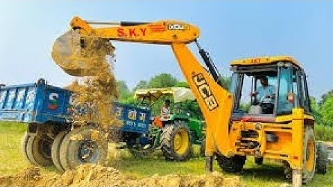 JCB 3DX Backhoe Loading Mud In 3 Tractor PowerTrac Tractor, Mahindra Yovo 575 DI, And New Holland