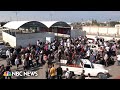 WATCH: Crowd gathers at Gaza&#39;s Rafah crossing waiting to enter Egypt