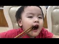 Baby  cute eating noodles with  sister