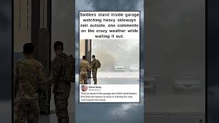 Soldiers stand inside garage watching heavy sideways rain outside #shorts
