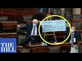 Bernie Sanders uses GIANT CHECKS to show Republicans what "SOCIALISM FOR THE RICH" really means